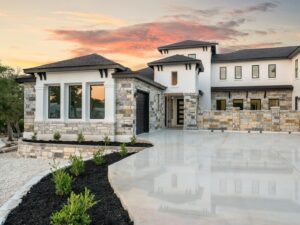 Modern luxury house with stone accents at sunset