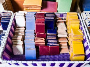 a basket filled with lots of different colored boxes