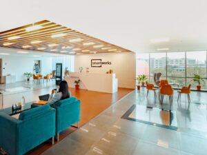 unknown person sitting on blue couch