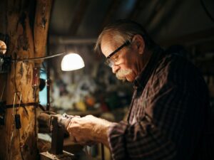 man in black and white plaid dress shirt wearing black framed eyeglasses